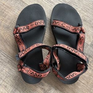 Teva Black and Orange Snake Sandals